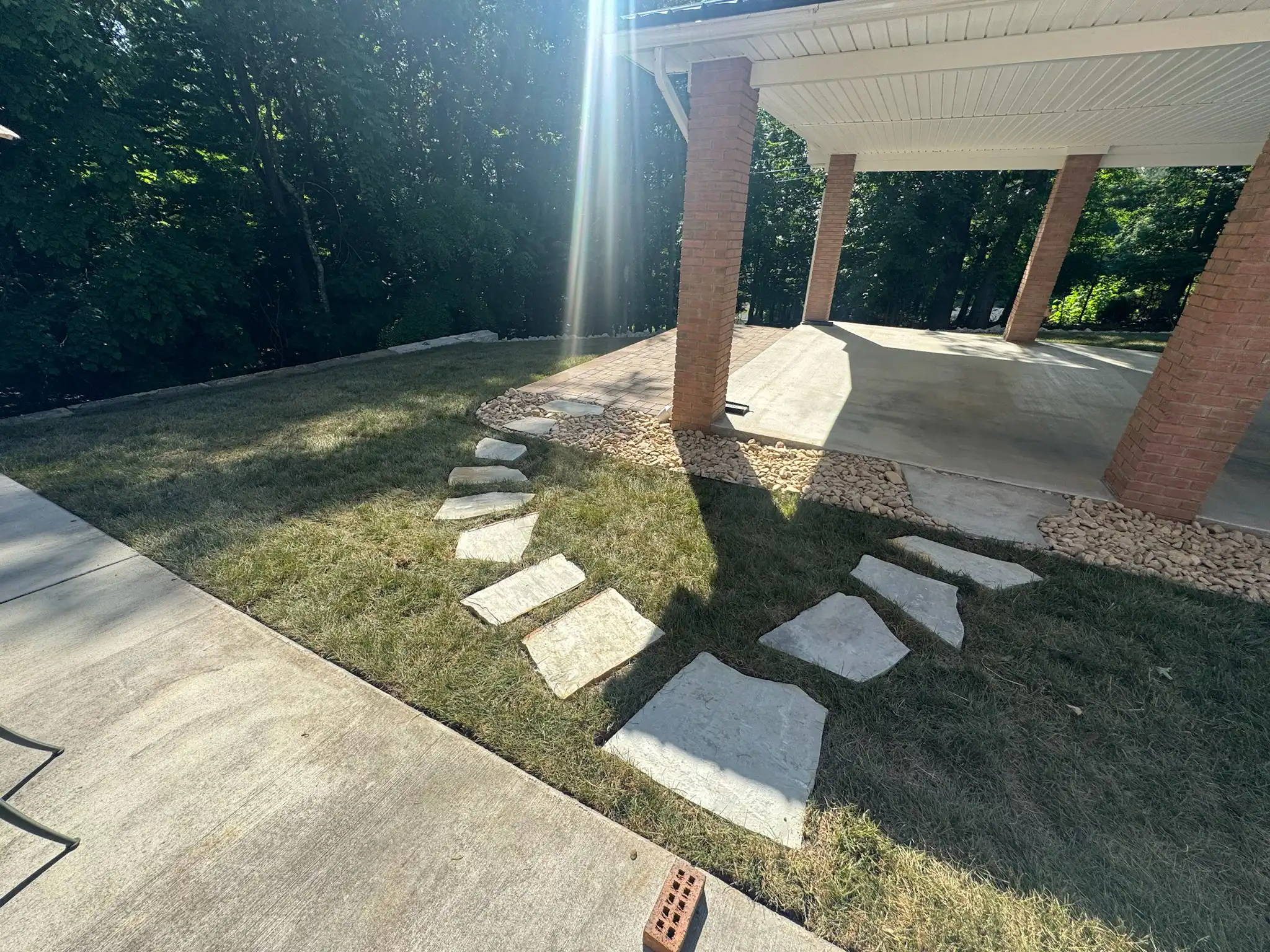 Sod installation with stepping stone path through a residential yard